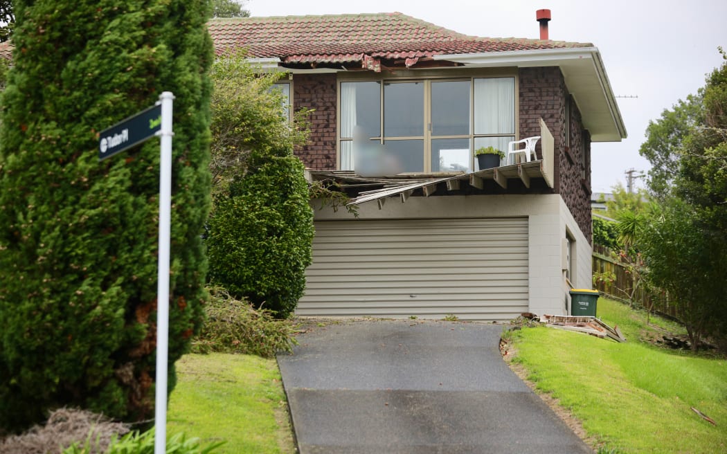 Damaged property in Honeysuckle Lane, Mairangi Bay where an elderly couple were trapped by a fallen tree early this morning.