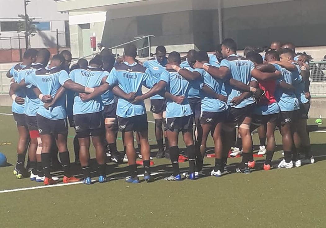 Fijian Drua players huddle together during the captain's run in Canberra.