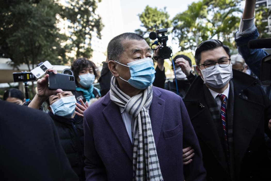 Hong Kong media tycoon Jimmy Lai (centre) arrives at the Court of Final Appeal in Hong Kong on December 31, 2020.