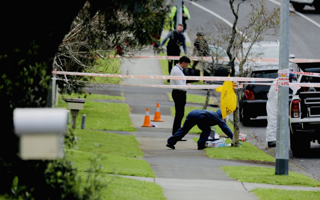 Police inside the cordon at the Bucklands Beach fire.
