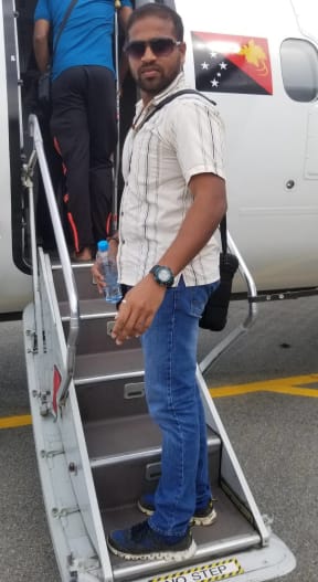Shaminda Kanapathi boards the plane to Port Moresby.