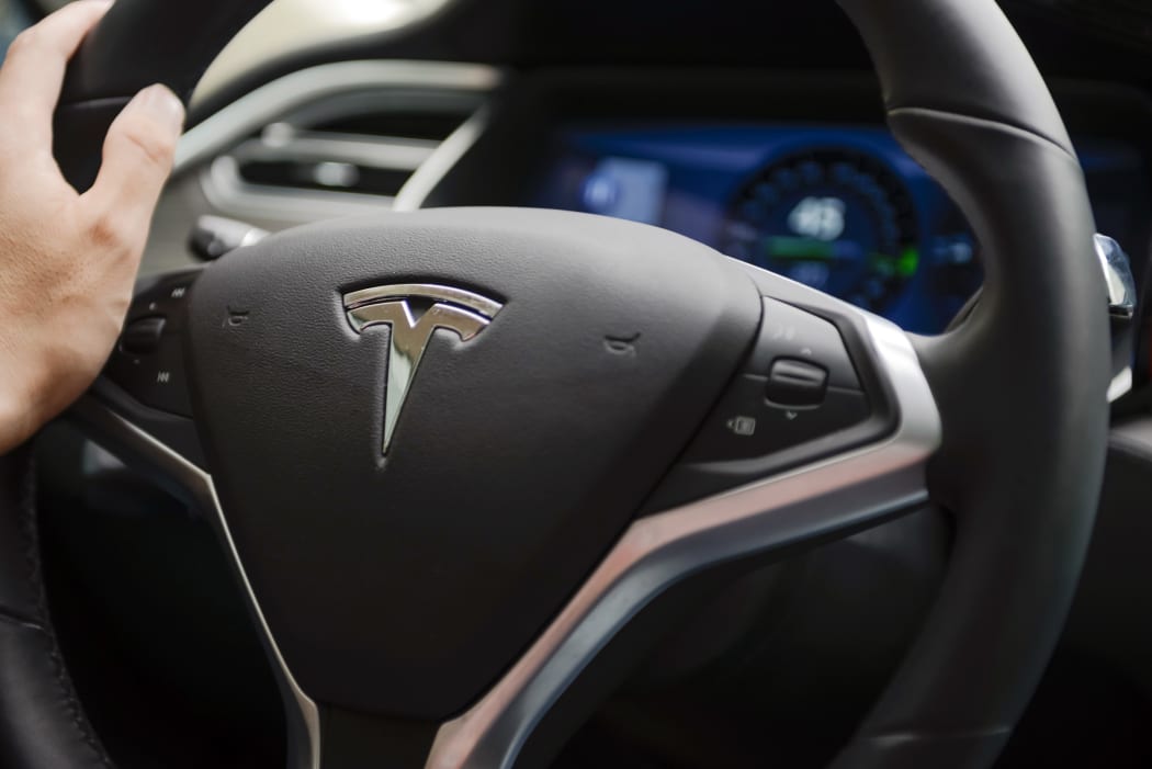A man drives his Tesla Model S electric car in Wuhan in central Chinese province Hubei (file).