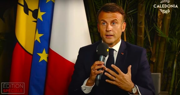 French President Emmanuel Macron speaks to local media pool just before leaving New Caledonia on 24 May 2024.