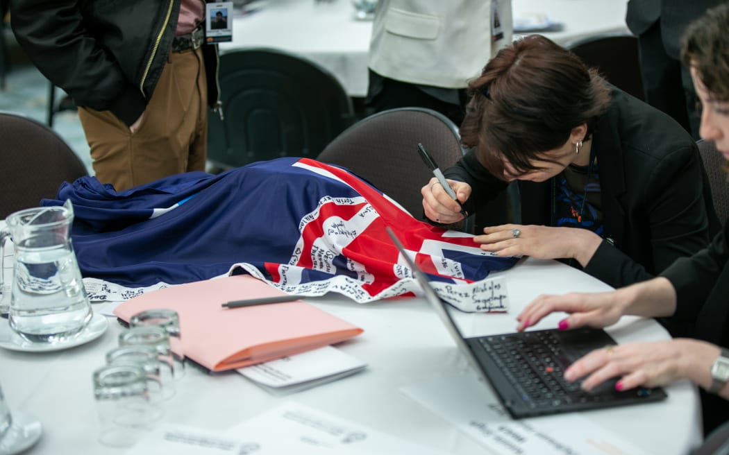 CYP delegate signs Queensland flag