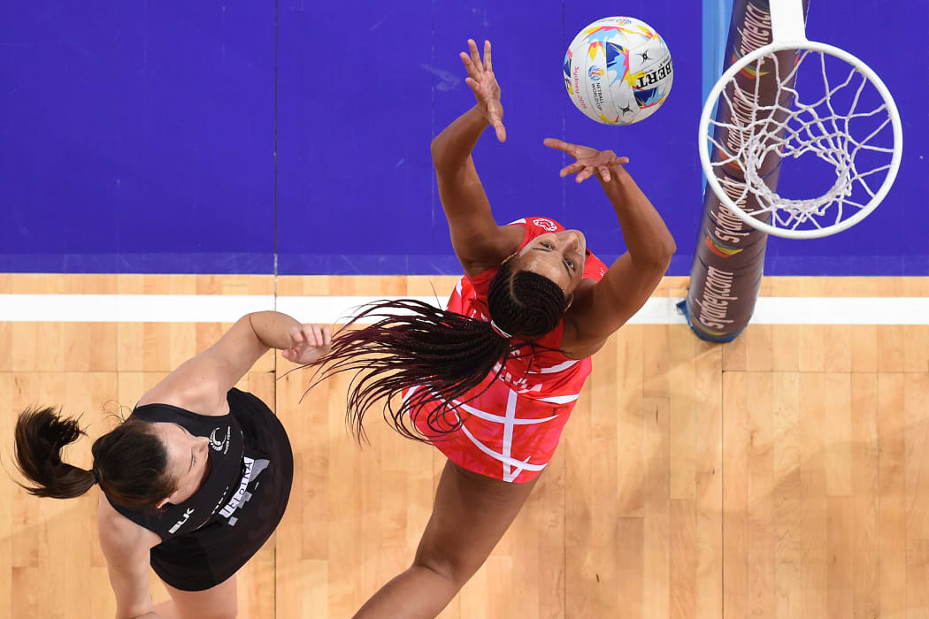 Bailey Mes of New Zealand (left) competes for the ball with Geva Mentor of England during the 1st semi-final in the Netball World Cup at Allphones Arena in Sydney.