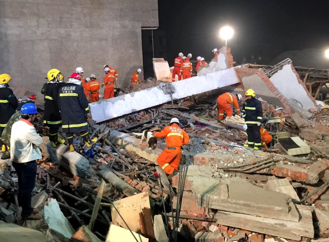 Rescuers search for survivors in Beiwudu Town, Wuyang County, central China's Henan Province