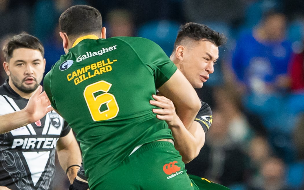 New Zealand's Joseph Manu is tackled by Australia's Reagan Campbell-Gillard - New Zealand Kiwis v Australia, Semi Final match of the Rugby League World Cup 2021 (played in 2022) at Elland Road, Leeds, England on Friday 11 November 2022. © Mandatory credit: Allan McKenzie / www.photosport.nz