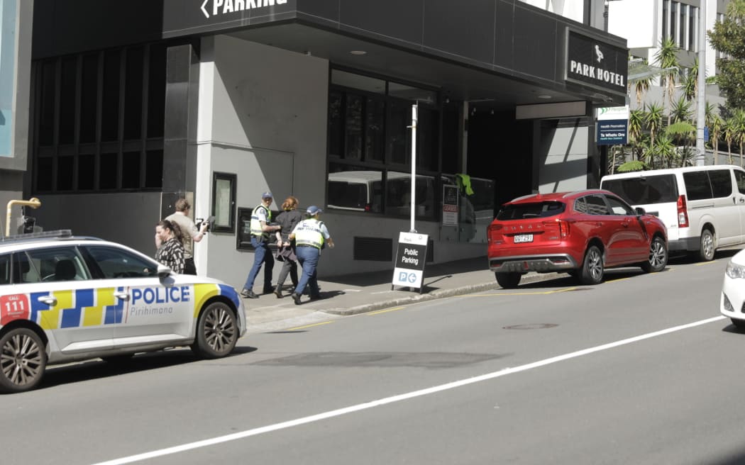 Greenpeace programme director Niamh O'Flynn being taken into police custody.