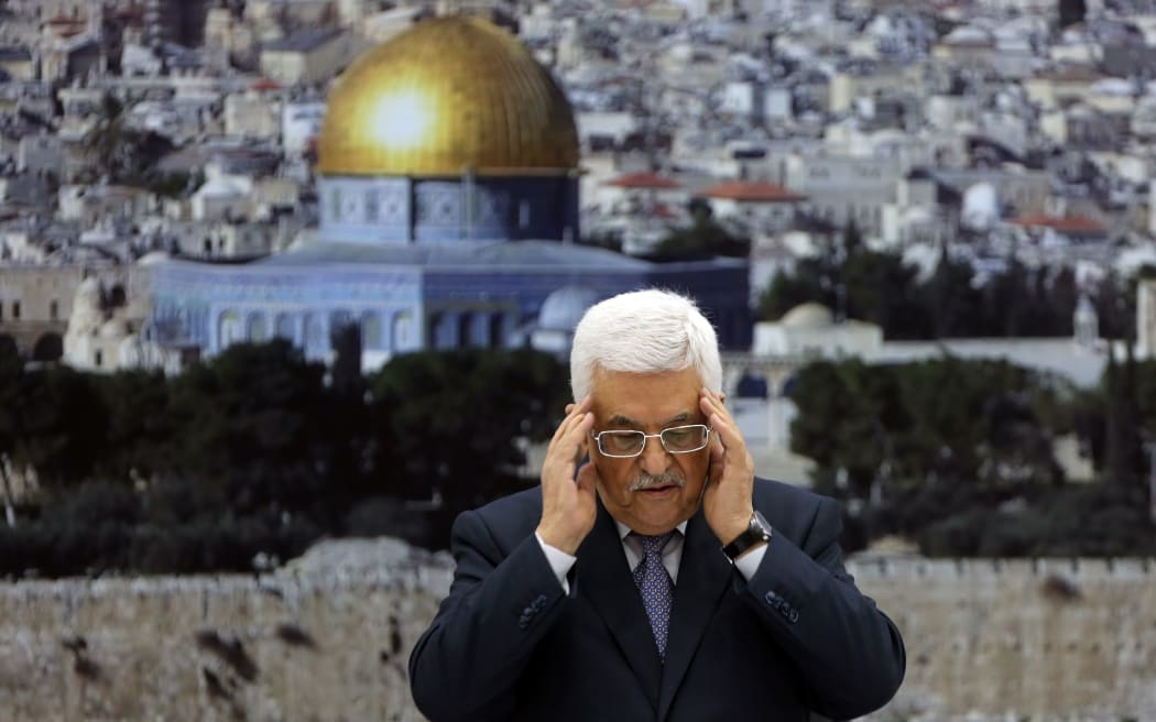 Palestinian president Mahmud Abbas recites a prayer in memory of those killed during the Gaza Strip conflict.