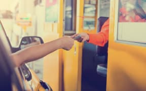 Driver pay for the expressway. Man pays money to a cashier for a toll road toll gate motorway entrance.