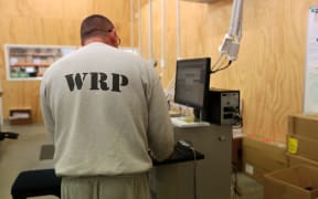 170714. Photo Diego Opatowski / RNZ. Visit to the Rimutaka Prison. Inmate working on the printing plant.