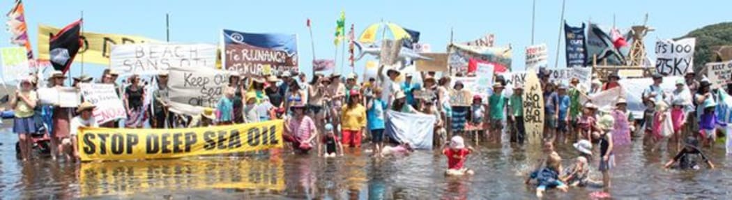 Banners on the beach at Bethells Beach