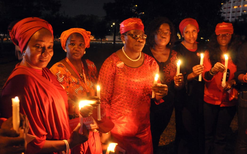 Campaigners for the release of abducted Chibok schoolgirls at a vigil in Abuja, Nigeria.