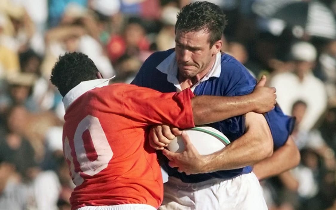 Alexandre Chazalet runs into Tonga's Elisi Vunipola during their 1999 test match in Nuku'alofa. Tonga won 20-15.