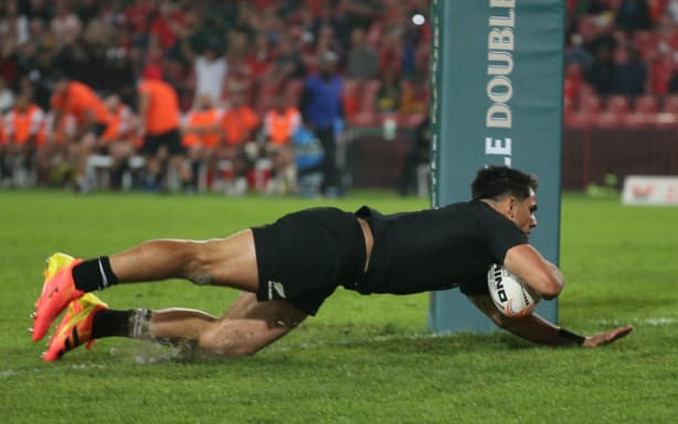 Noah Hotham scores a try.