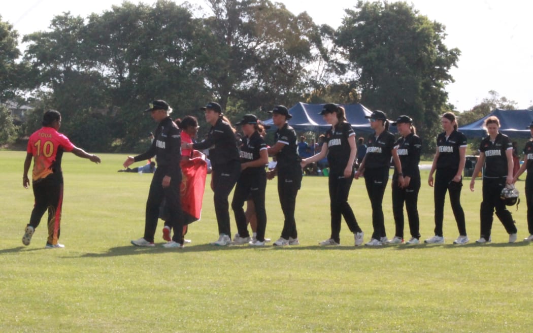 Aotearoa Maori captain Kerry Tomlinson leads her team to shake hands with the victorious Papua New Guineans.