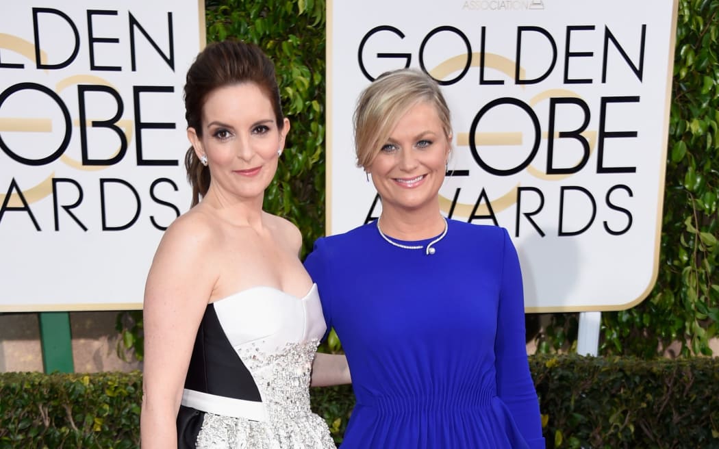 Golden Globes hosts Tina Fey (L) and Amy Poehler.