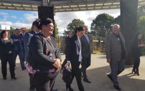 Prime Minister Jacinda Ardern, centre, walks on to Te Puia tourism centre in Rotorua. Te Puia and the Māori arts and crafts training centre will receive $7.6 million from the government to safeguard its future.