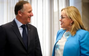 Prime Minister John Key (left) and Judith Collins (right) after Ms Collins was re-appointed as a Minister 14.12.15.