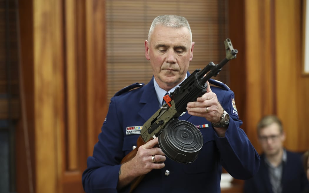 Police officer Paddy Hennan demostrates illegal gun modifications