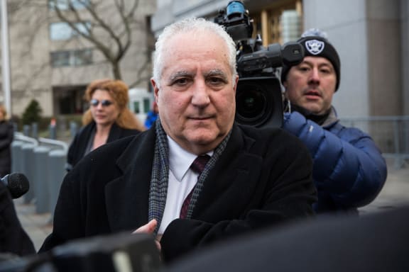 Daniel Bonventre leaves court after being found guilty of aiding, assisting and profiting from the Ponzi scheme run by Madoff.