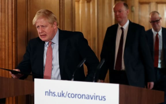 Britain's Prime Minister Boris Johnson  arrives at a news conference addressing the government's response to the novel coronavirus COVID-19 outbreak, at 10 Downing Street.