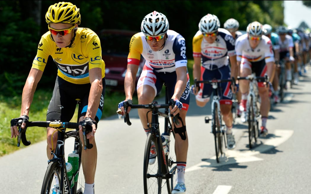 Greg Henderson tucks in behind yellow jersey holder Chris Froome during the 2013 Tour de France.