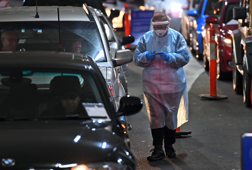 A medic at a drive-through Covid-19 testing site in a Melbourne shopping centre on 26 June, 2020.