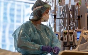 This image released by Northwestern Medicine, shows nurses at the Covid-19 Intensive Care Unit of Northwestern Memorial Hospital in Chicago.