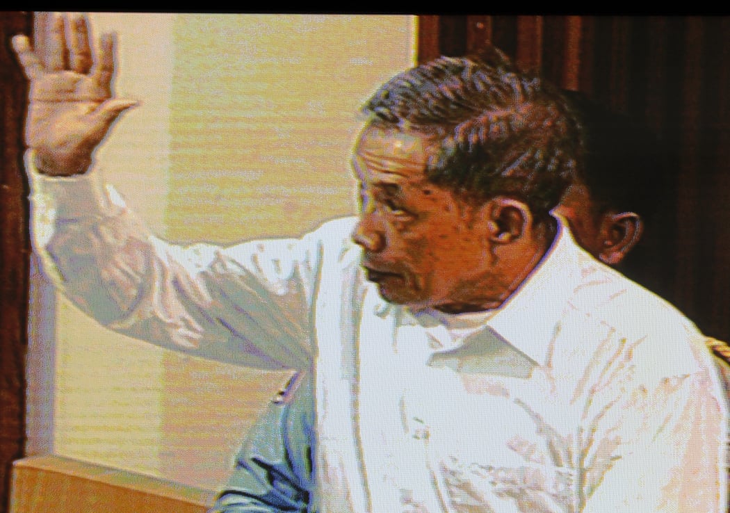 A livefeed video grab taken on July 13, 2009, shows Kaing Guek Eav better known as Comrade Duch, the former Khmer Rouge prison chief of S-21 or Tuol Sleng prison, in the courtroom during his trial at the Extraodinary Chambers in the Courts of Cambodia (ECCC) in Phnom Penh.