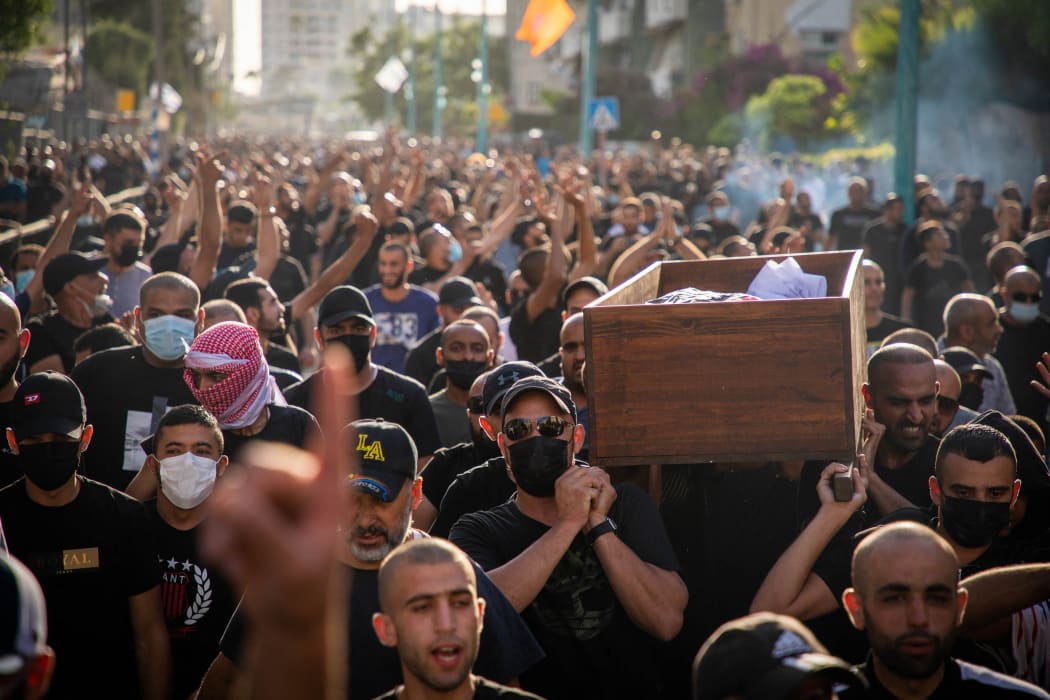 Palestinians carry the coffin of Palestinian Musa Hassune who was killed by an Israeli gunman's fire.