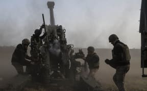 KHERSON OBLAST, UKRAINE - NOVEMBER 05: A howitzer, belonging to Ukrainian artillery battery attached to the 59th Mechanized Brigade, shoots-off to target the points controlled by Russian troops in order to support to the Ukrainian army as Russia-Ukraine war continues in Kherson Oblast, Ukraine on November 05, 2022. (Photo by Metin Aktas/Anadolu Agency via Getty Images)