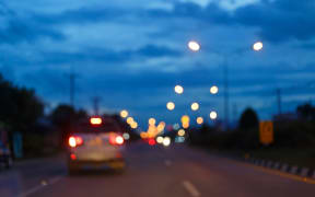 night light of traffic car on the city street, abstract blur bokeh background