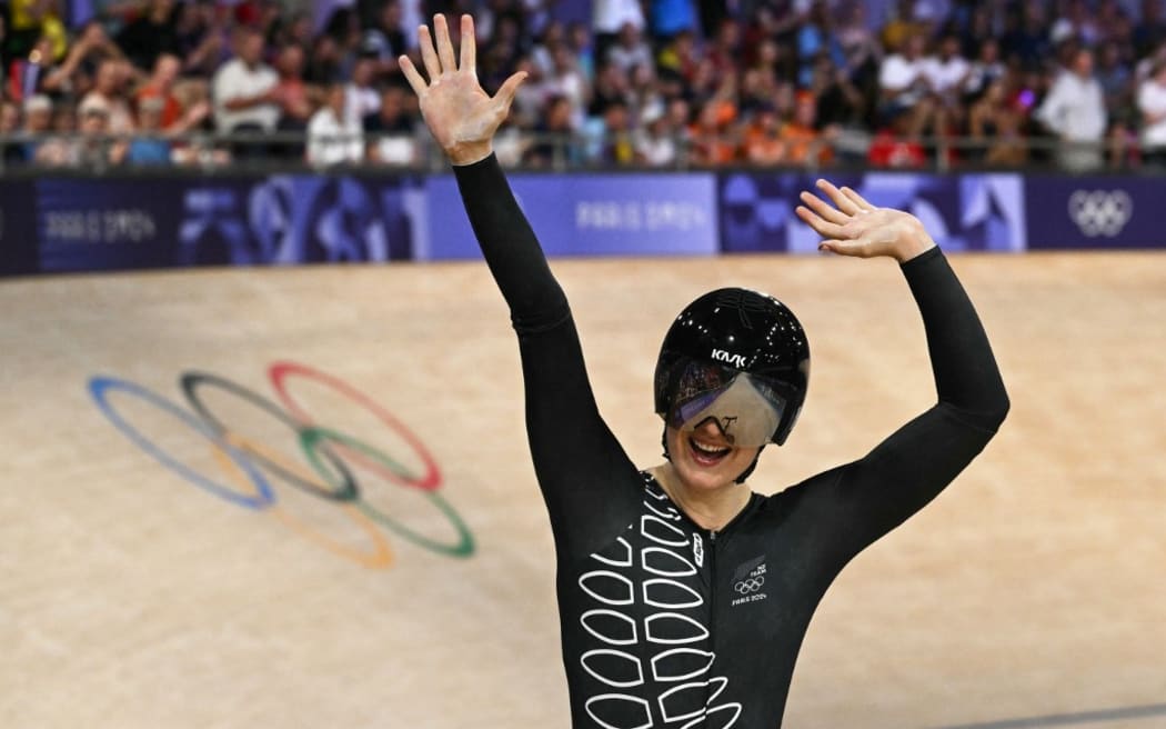 New Zealand's Ellesse Andrews celebrates after winning the women's track cycling sprint final race 2 for gold of the Paris 2024 Olympic Games at the Saint-Quentin-en-Yvelines National Velodrome in Montigny-le-Bretonneux, south-west of Paris, on August 11, 2024. (Photo by SEBASTIEN BOZON / AFP)