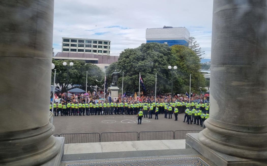 Police and protesters at Parliament.