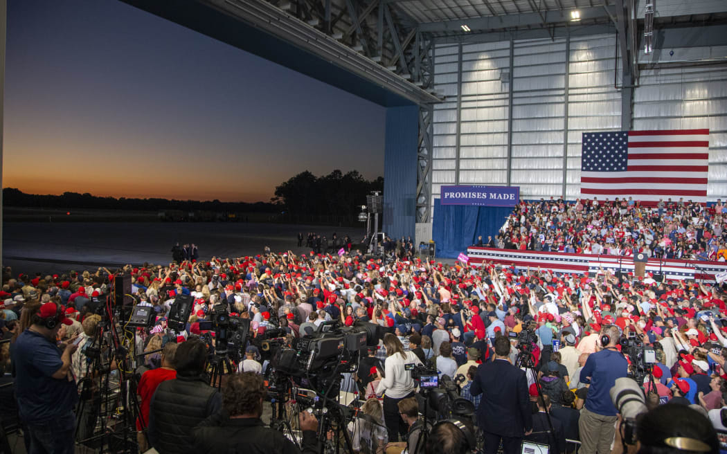 The hanger doors open as supporters wait for the arrival of Air Force One and US President Donald Trump at the Pensacola campaign rally.