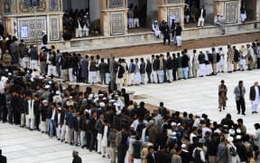 Afghan voters queuing in the Jamee mosque of Herat.