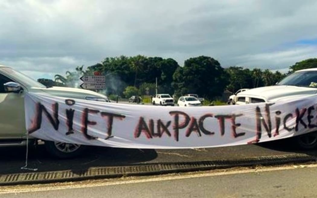 An anti-nickel pact banner in New Caledonia’s Northern town of La Foa.