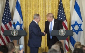US President Donald Trump (R) and Israeli Prime Minister Benjamin Netanyahu hold a joint press conference in the East Room of the White House in Washington.