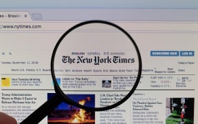 The New York Times logo on a computer screen with a magnifying glass (Flickr user Marco Verch CC BY 2.0)