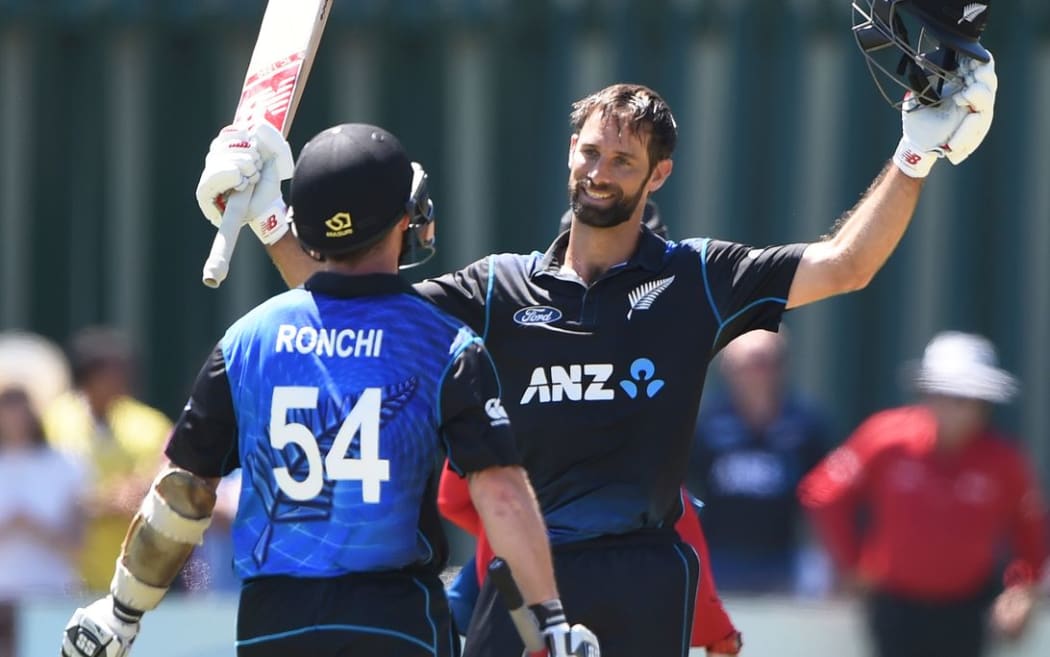 Grant Elliott celebrates his century with Luke Ronchi during the fifth ODI between New Zealand and Sri Lanka in Dunedin.