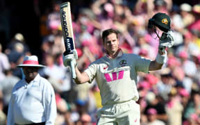 Australia’s Steve Smith celebrates reaching his century (100-runs) on day three of the fifth Ashes cricket Test between Australia and England at the Sydney Cricket Ground in Sydney on January 6, 2026. (Photo by Saeed KHAN / AFP) / -- IMAGE RESTRICTED TO EDITORIAL USE - STRICTLY NO COMMERCIAL USE --