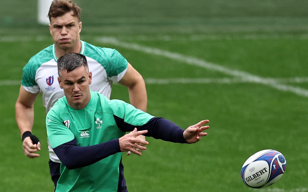 Ireland's fly-half Jonathan Sexton passes the ball during a training session at the Stade de France, in Saint-Denis, on the outskirts of Paris, on October 13, 2023, on the eve of the France 2023 Rugby World Cup quarter-final match between Ireland and New Zealand. (Photo by FRANCK FIFE / AFP)