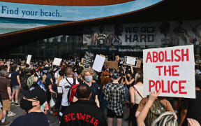 Protesters gather during a "Black Lives Matter" protest near Barclays Center on May 29, 2020 in the Brooklyn borough of New York City, in outrage after George Floyd, an unarmed black man, died while being arrested