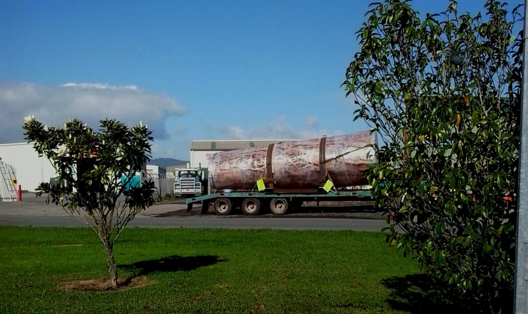 A kauri log carving wrapped in plastic, leaving a warehouse in Awanui for export.