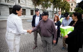 Representatives from Groundswell NZ deliver a petition to Parliament against the emissions trading scheme.