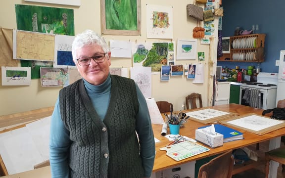 Writer, illustrator and historian Mere Whaanga in her Māhia studio