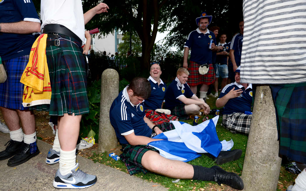 A Scotland fan appears to have passed out prior to kick off.