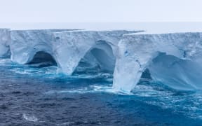 This handout image released by EYOS Expeditions on January 19, 2024, shows an aerial view of the A23a iceberg in the waters of The Southern Ocean off Antarctica on January 14. The world's biggest iceberg, which split from the Antarctic coastline in 1986, continues to be on the move after more than 30 years. At almost 4,000 sq km (1,500 sq miles) in area, more than twice the size of Greater London, and approx 400m (1,312 ft) thick. The tooth-shaped iceberg named A23a is more than twice the size of Greater London. After three decades stuck to the Antarctic sea floor, the iceberg is heading northeast, being battered by waves in what is thought to be its final months. It is estimated to weigh nearly a trillion tonnes and be 400 metres (1,300 feet) thick at its deepest points. (Photo by Richard Sidey / EYOS Expeditions / AFP) / RESTRICTED TO EDITORIAL USE - MANDATORY CREDIT "AFP PHOTO/EYOS EXPEDITIONS/RICHARD SIDEY " - NO MARKETING - NO ADVERTISING CAMPAIGNS - DISTRIBUTED AS A SERVICE TO CLIENTS - RESTRICTED...