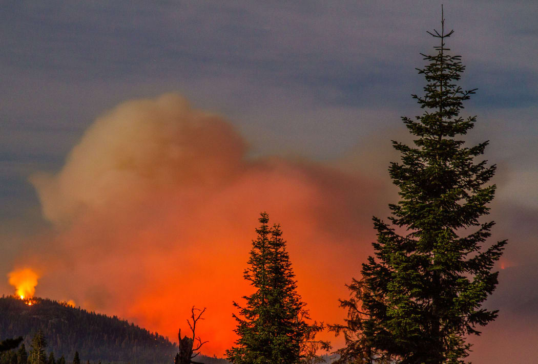 USA, Kings Canyon: The so-called Rough wildfire — which had spread over 95,000 acres in the Sierra Nevada mountains by September 8, 2015 — is photographed as it burns through Kings Canyon National Park in California on August 28